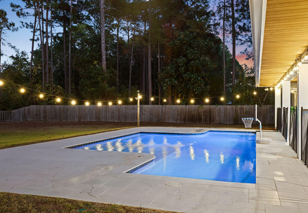 442 Shipwreck Road Santa Rosa Beach, FL 32459 - Photo 85 of 103 a view of a swimming pool with an outdoor space and seating area