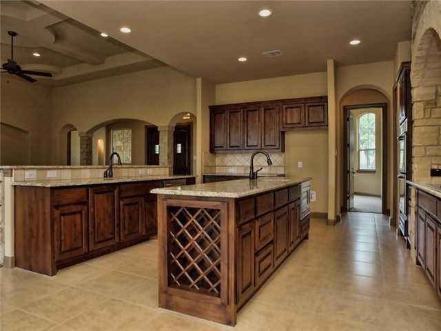 104 Vista Lane Georgetown, TX 78633 - Photo 7 of 36 A true entertainer's dream this kitchen spares no expense with plenty of room.