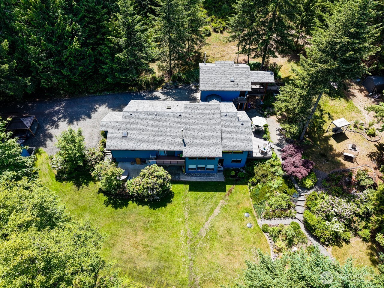 492 Walkabout Way Port Angeles, WA 98363 - Photo 9 of 40 an aerial view of a house with swimming pool and garden
