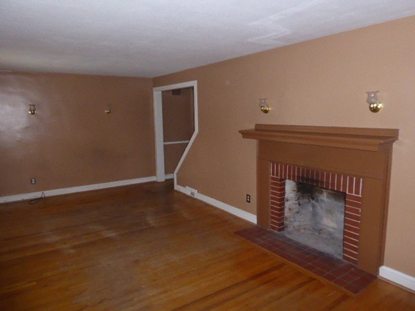 170 Brittany Road Springfield, MA 01151 - Photo 2 of 11 a room with a fireplace