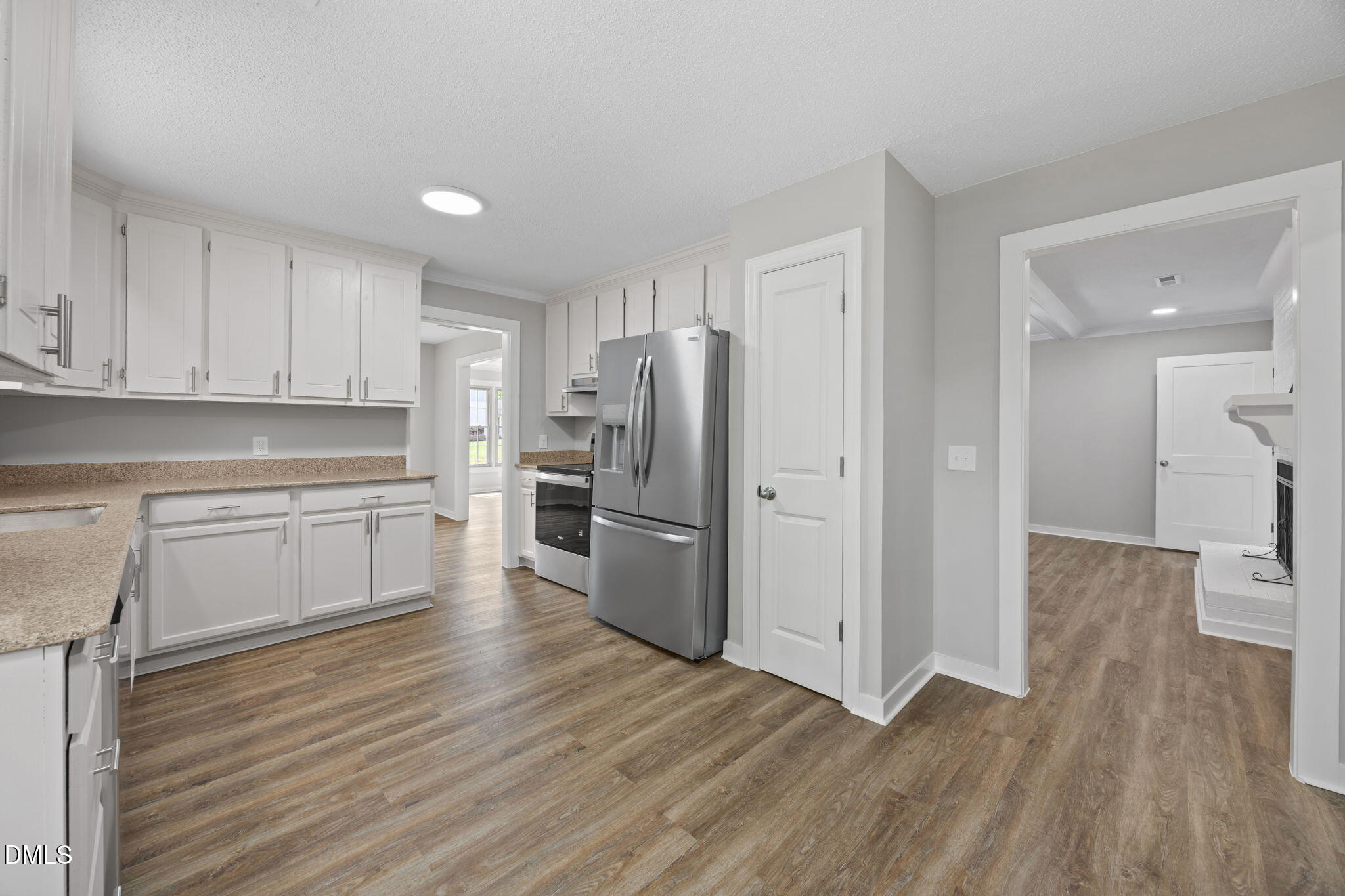 309 Rippling Stream Road Durham, NC 27704 - Photo 14 of 45 a kitchen with a refrigerator and a stove top oven