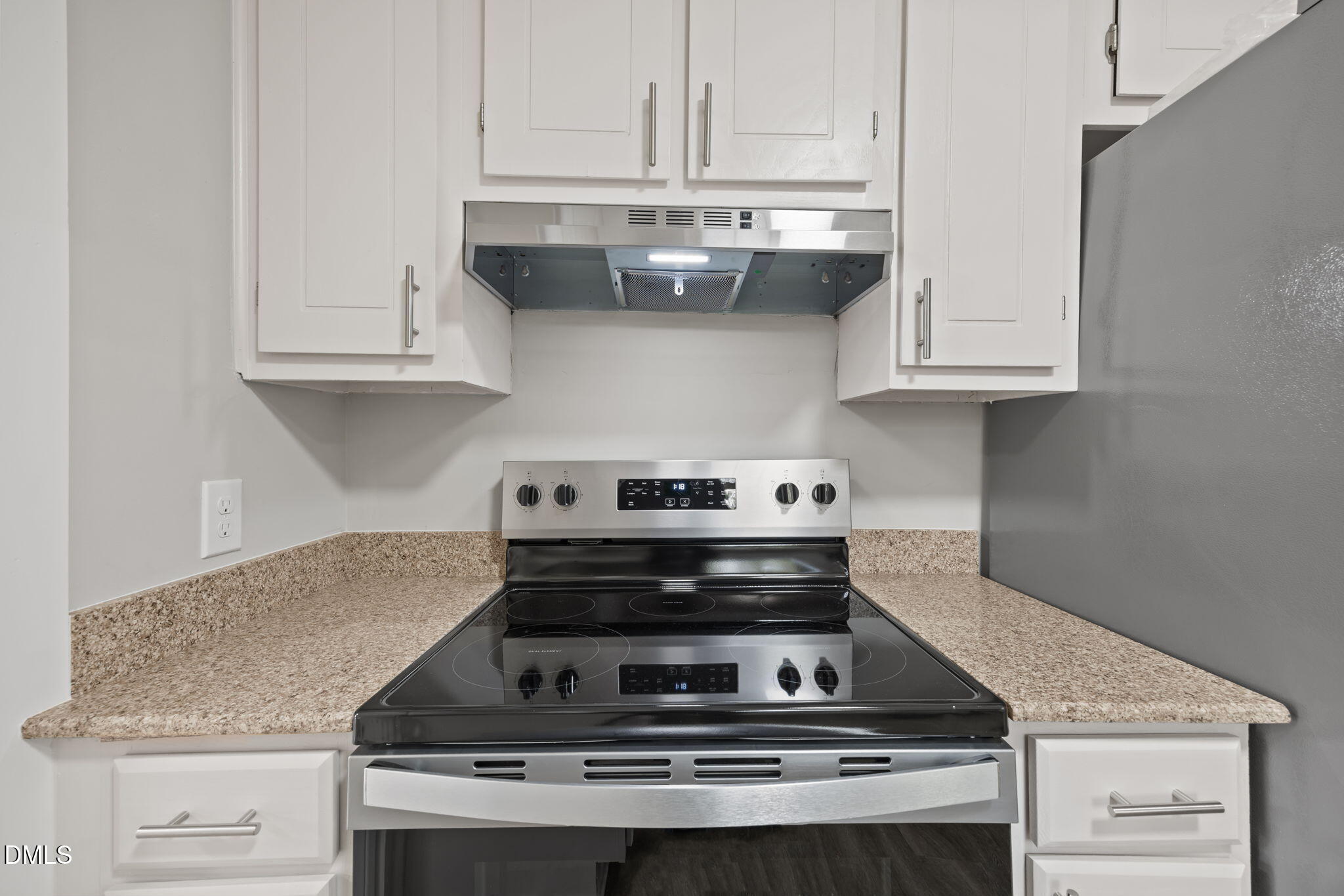 309 Rippling Stream Road Durham, NC 27704 - Photo 16 of 45 a stove top oven sitting inside of a kitchen