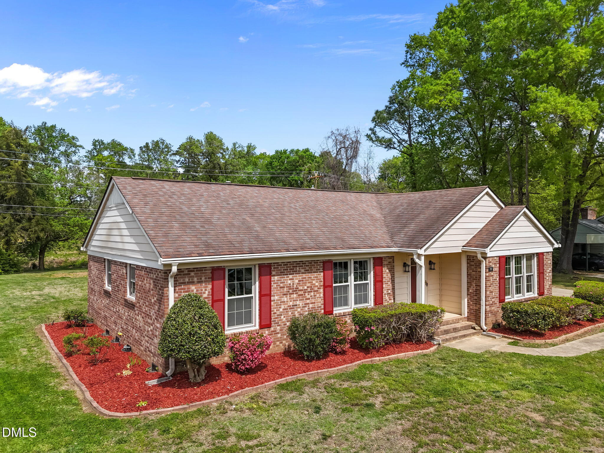309 Rippling Stream Road Durham, NC 27704 - Photo 2 of 45 a front view of a house with a yard