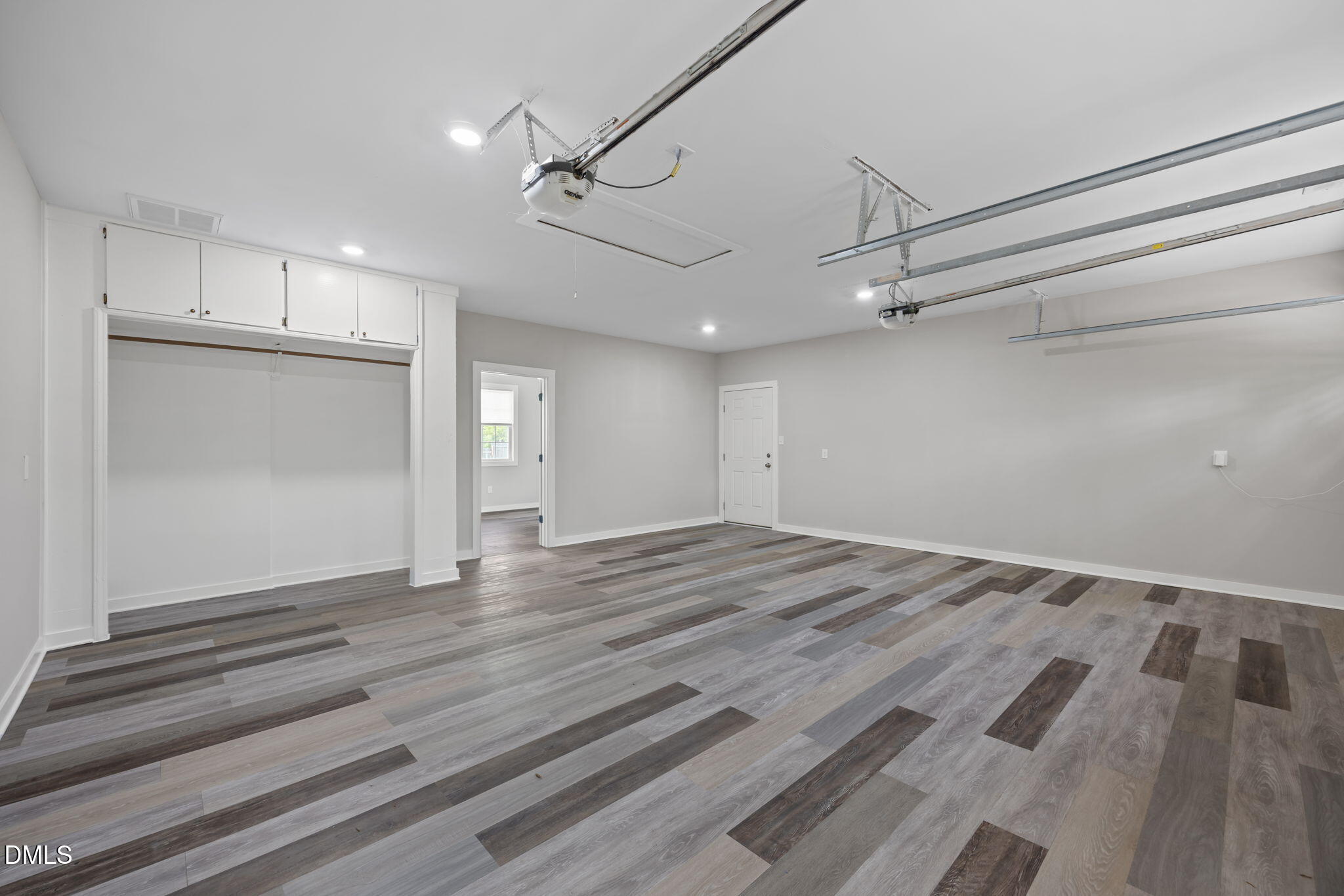 309 Rippling Stream Road Durham, NC 27704 - Photo 24 of 45 a view of empty room with wooden floor and fan