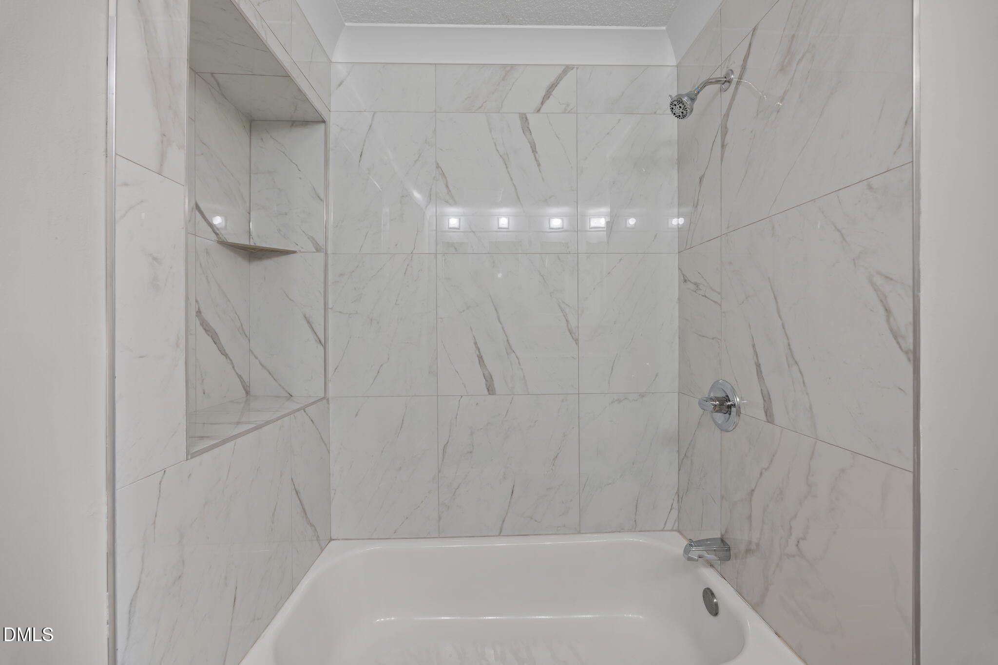 309 Rippling Stream Road Durham, NC 27704 - Photo 31 of 45 a bathroom with a shower and a bath tub
