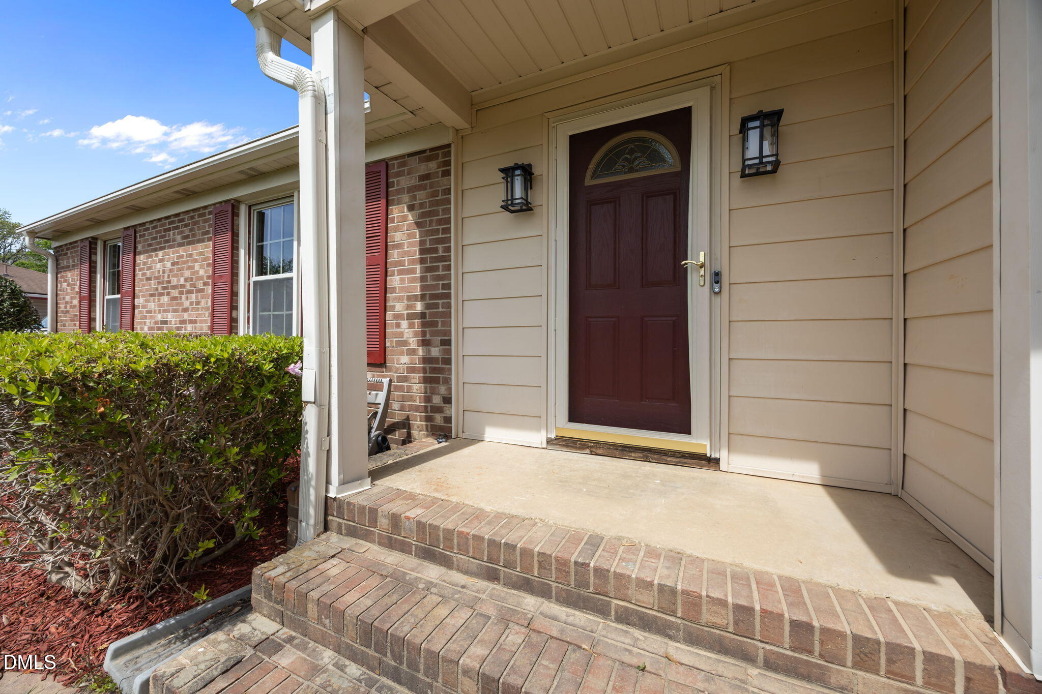 309 Rippling Stream Road Durham, NC 27704 - Photo 39 of 45 a view of a brick house with a large window