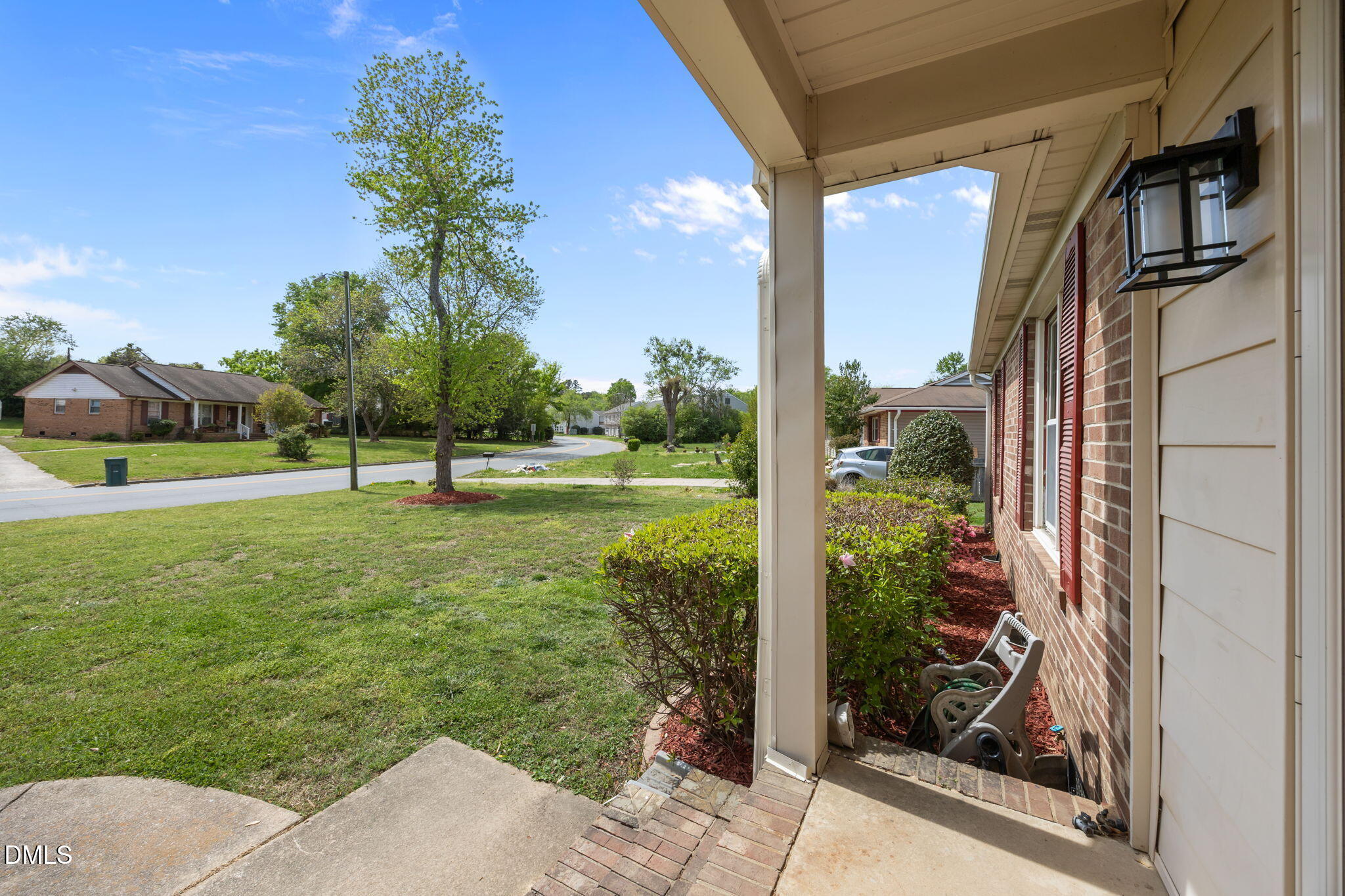 309 Rippling Stream Road Durham, NC 27704 - Photo 40 of 45 a view of a big room with a big yard and potted plants