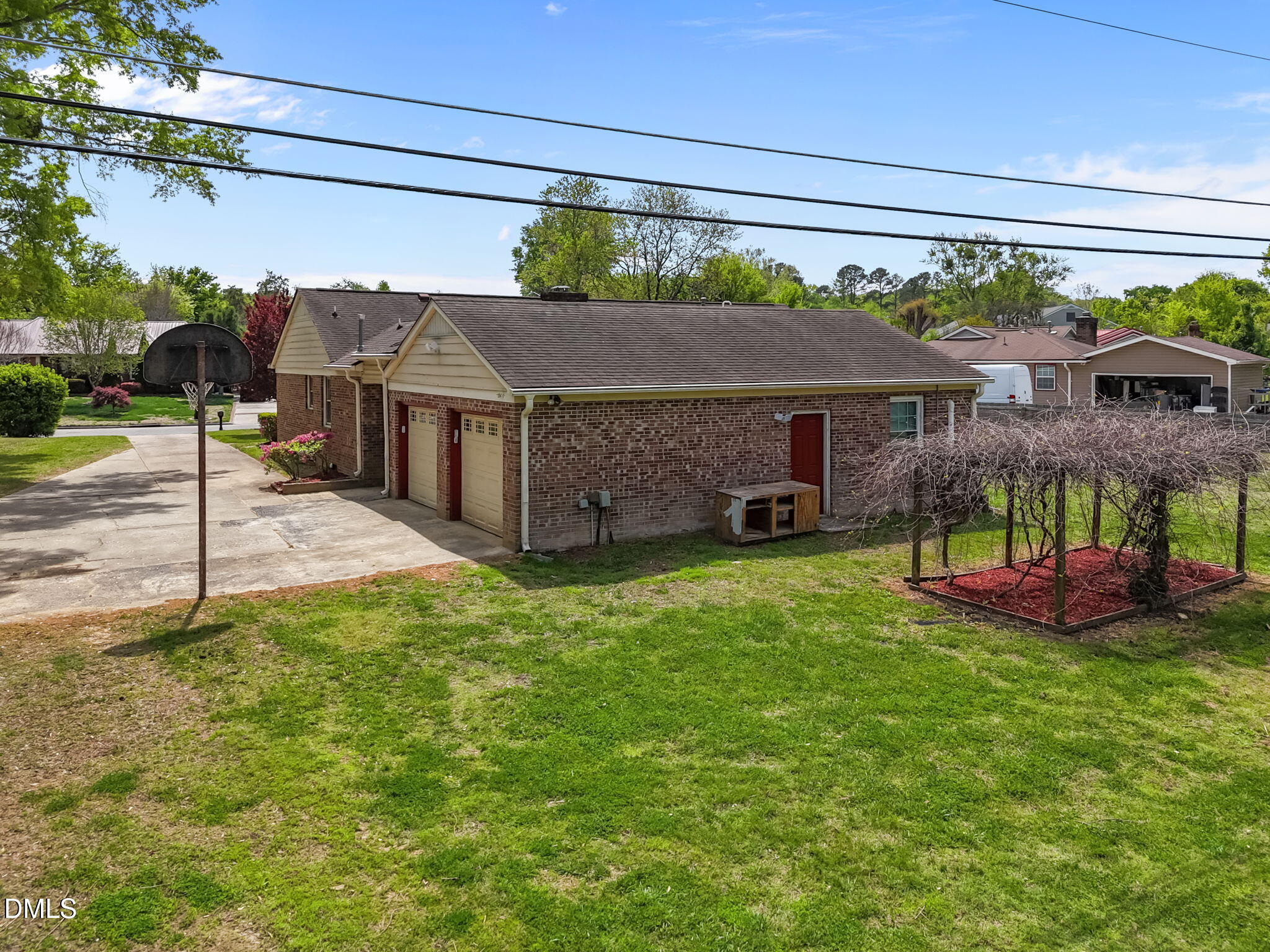 309 Rippling Stream Road Durham, NC 27704 - Photo 4 of 45 a front view of a house with a garden and plants