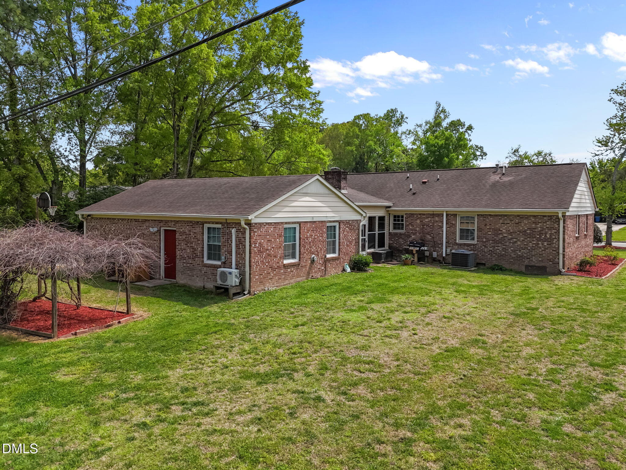 309 Rippling Stream Road Durham, NC 27704 - Photo 5 of 45 a front view of a house with garden