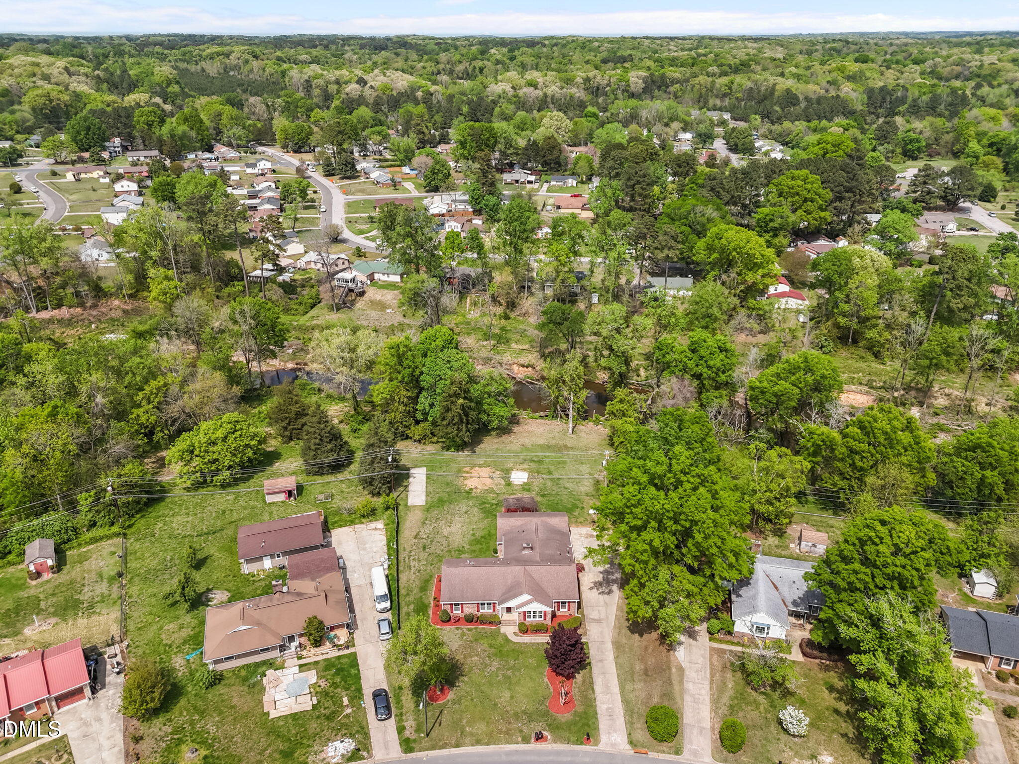 309 Rippling Stream Road Durham, NC 27704 - Photo 8 of 45 an aerial view of residential houses with outdoor space and trees
