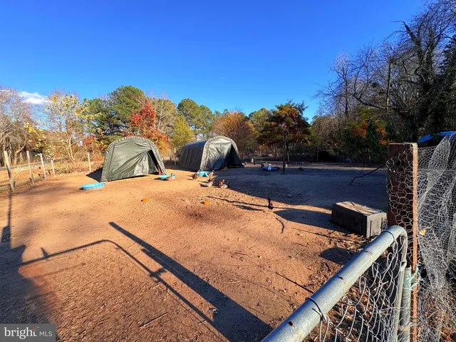 a view of swimming pool with outdoor seating and city view