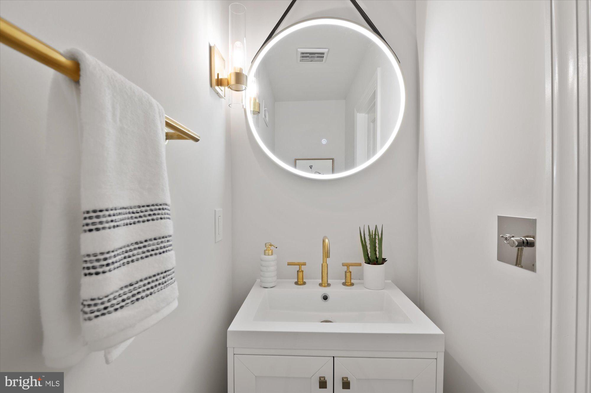 1831 12th Street Northwest Washington, DC 20009 - Photo 20 of 47 a bathroom with a sink and a mirror