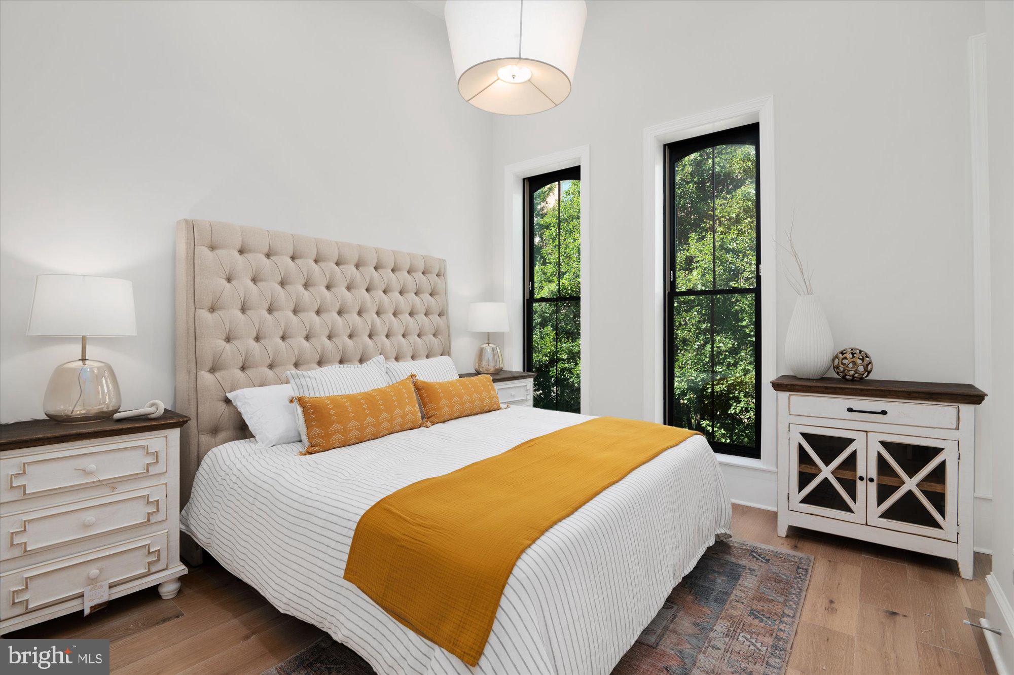 1831 12th Street Northwest Washington, DC 20009 - Photo 22 of 47 a bedroom with a bed and a window