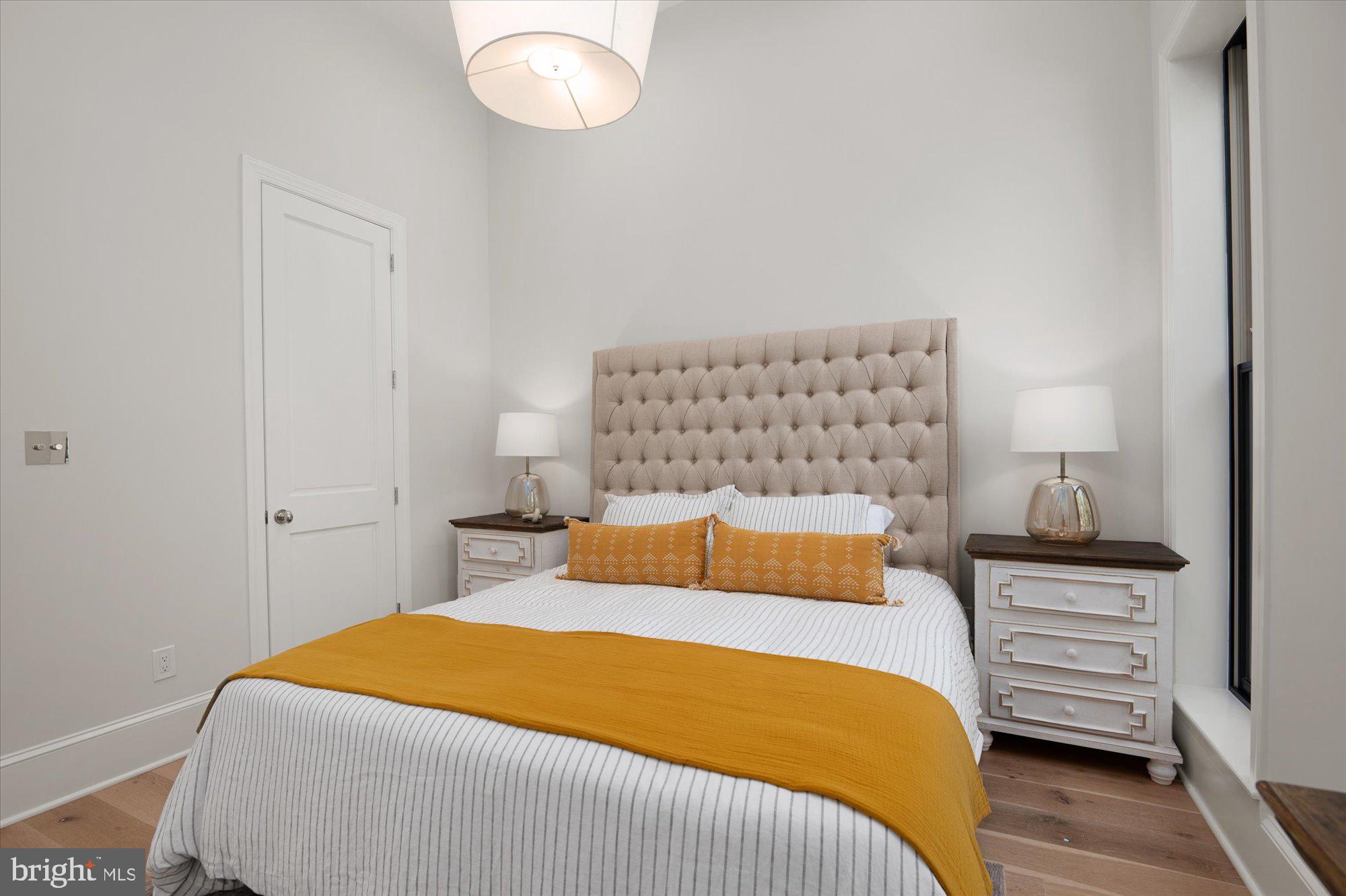 1831 12th Street Northwest Washington, DC 20009 - Photo 23 of 47 a bedroom with a bed and lamp