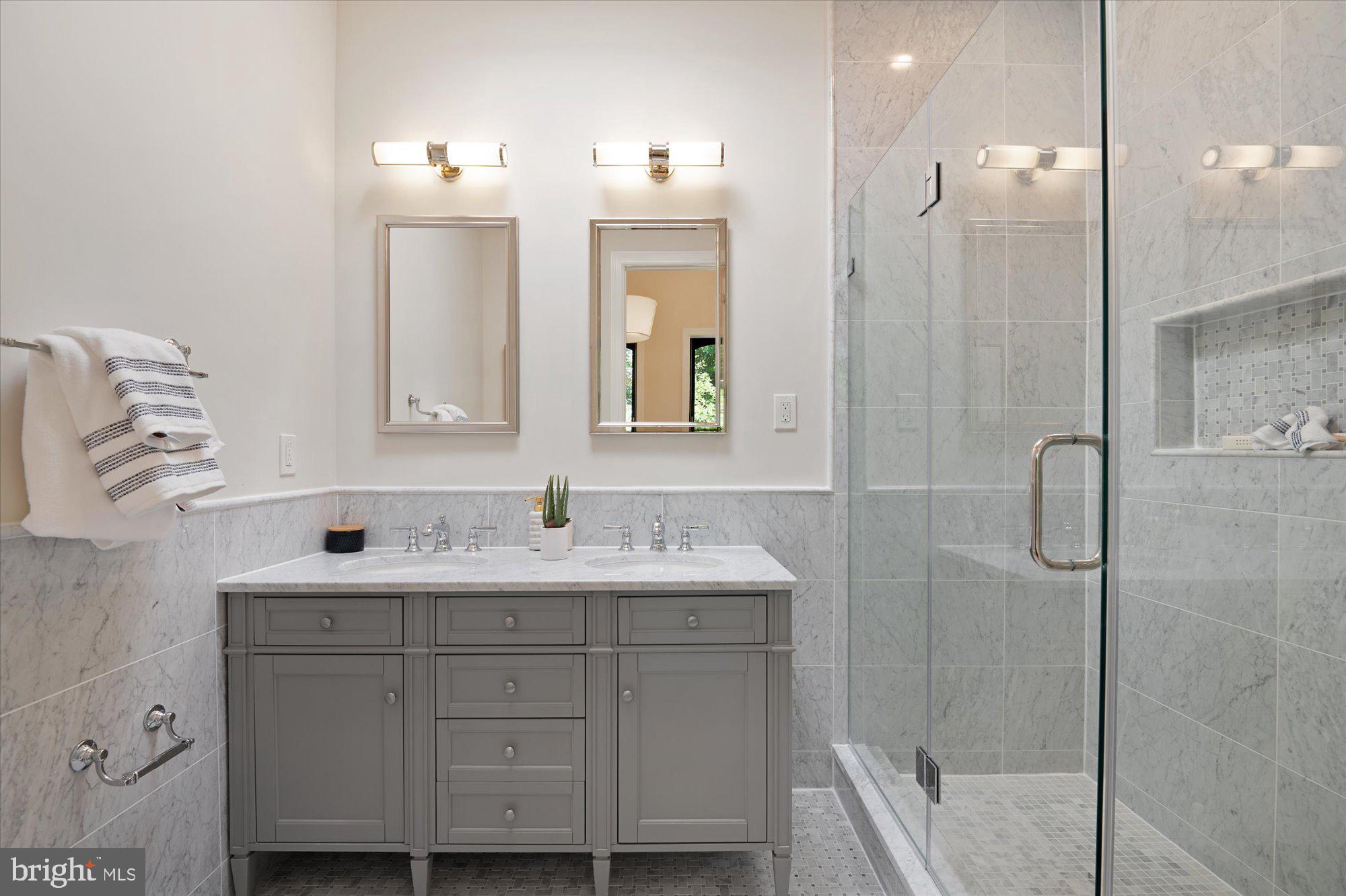 1831 12th Street Northwest Washington, DC 20009 - Photo 27 of 47 a bathroom with a double vanity sink mirror and shower