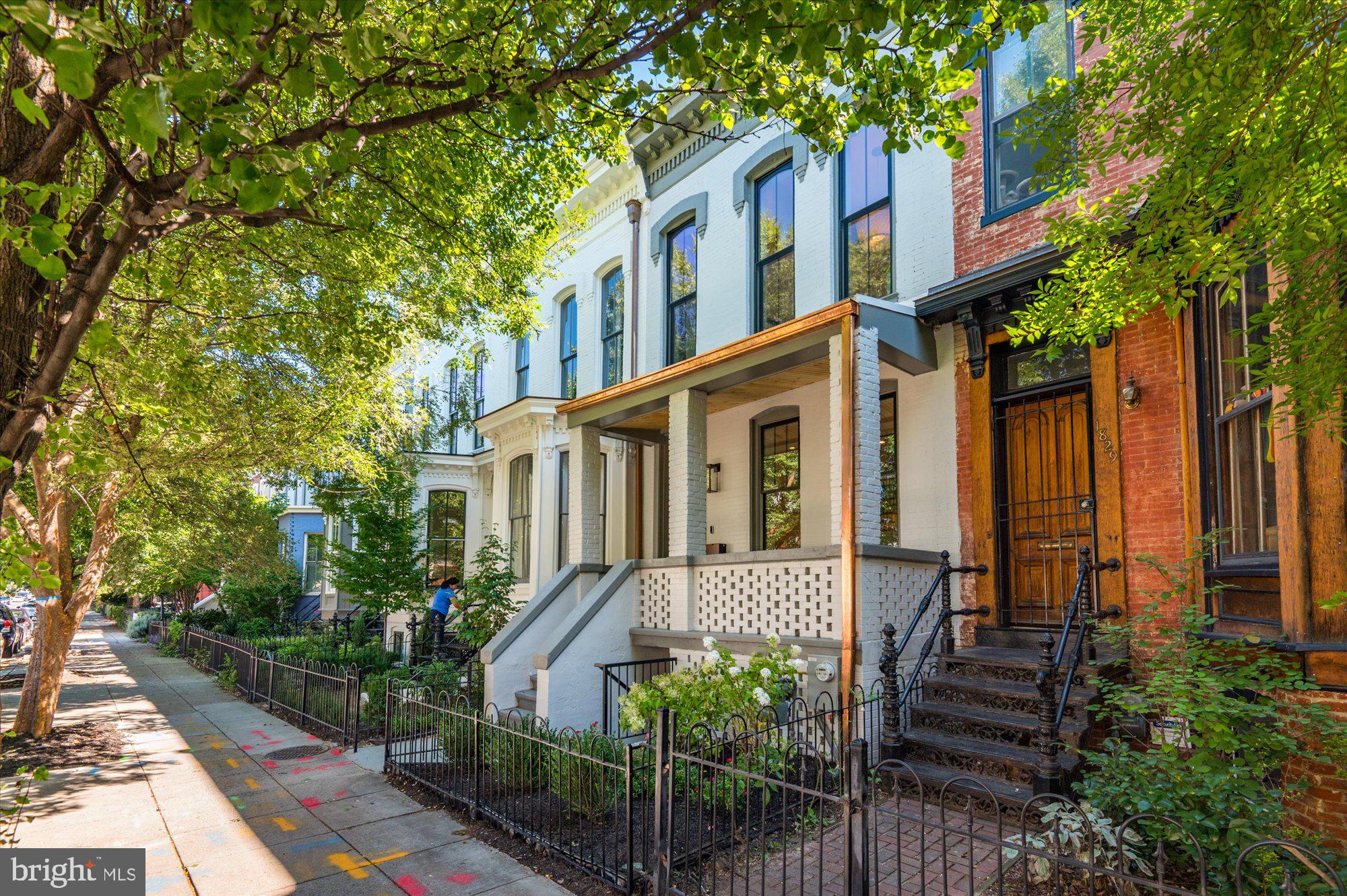 1831 12th Street Northwest Washington, DC 20009 - Photo 3 of 47 a front view of a house with plants and garden
