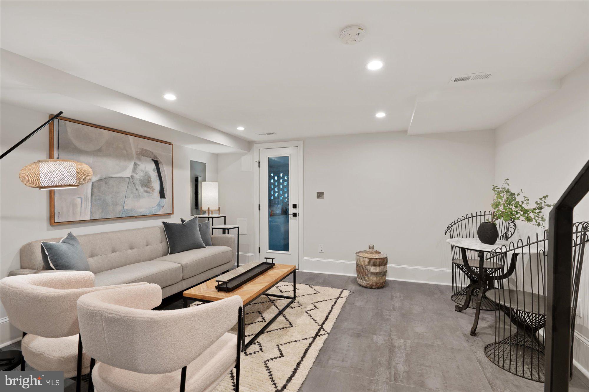 1831 12th Street Northwest Washington, DC 20009 - Photo 34 of 47 a living room with furniture and a potted plant
