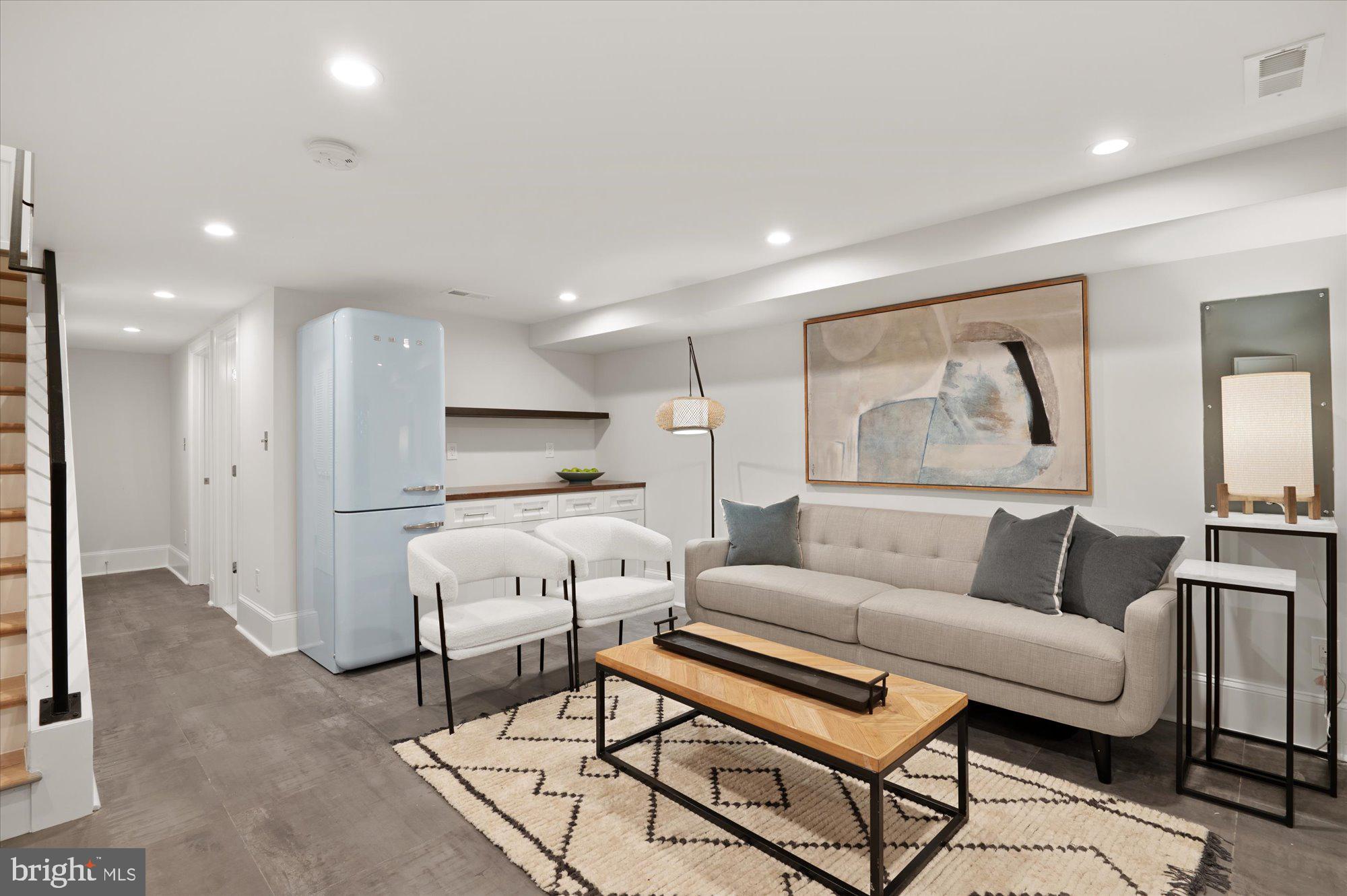 1831 12th Street Northwest Washington, DC 20009 - Photo 35 of 47 a living room with furniture and a wooden floor