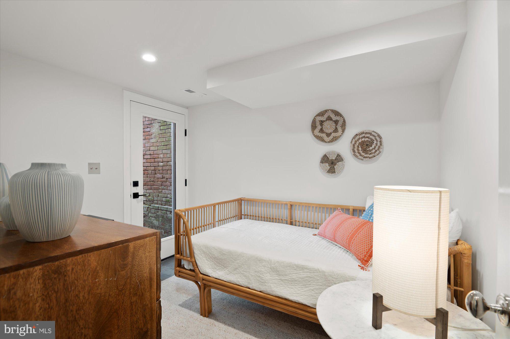 1831 12th Street Northwest Washington, DC 20009 - Photo 37 of 47 a bedroom with a bed and a flat screen tv