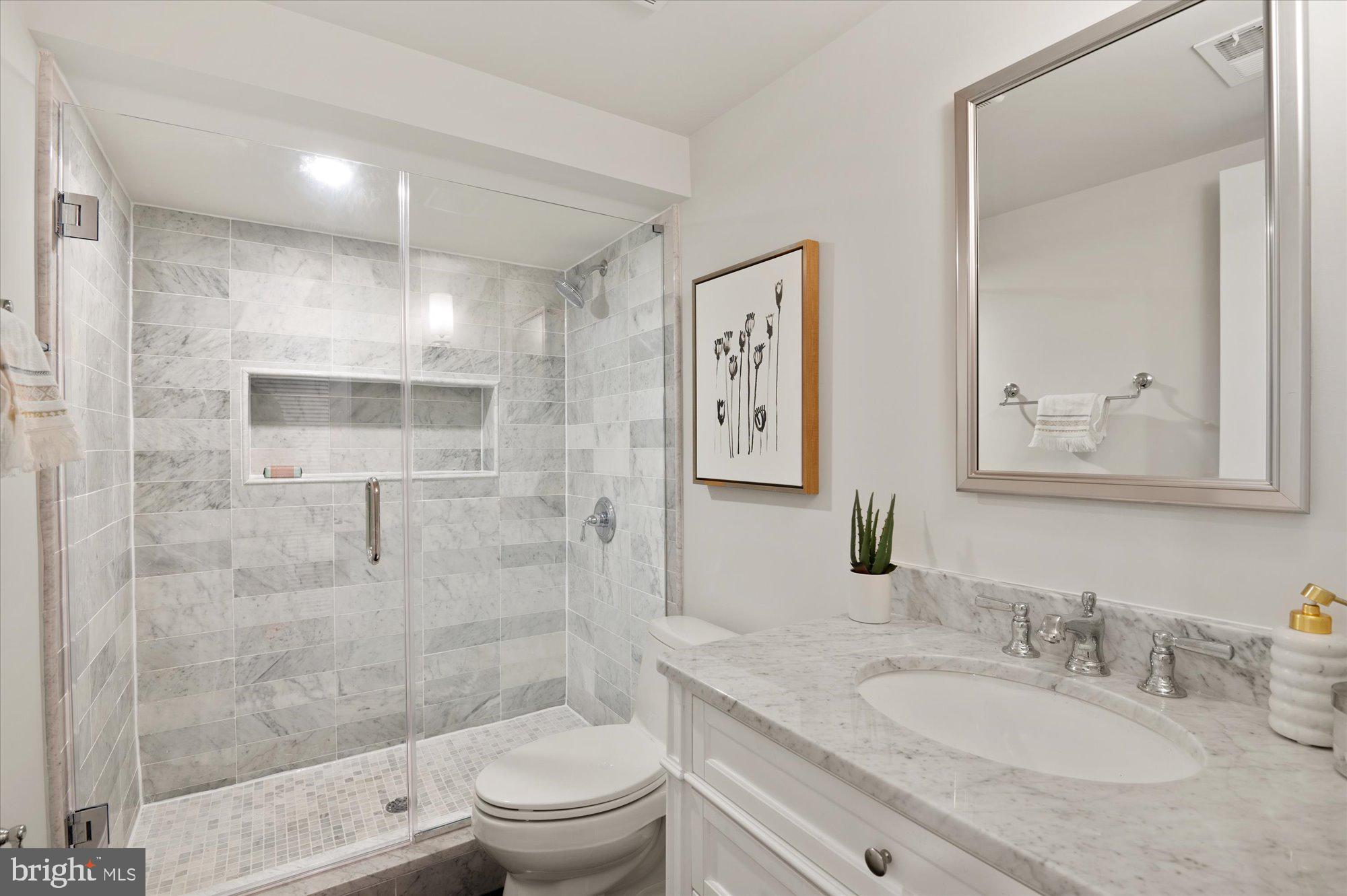1831 12th Street Northwest Washington, DC 20009 - Photo 39 of 47 a bathroom with a granite countertop sink toilet and shower