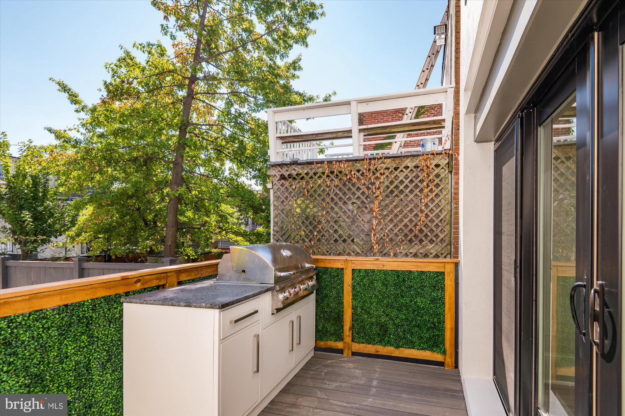 1831 12th Street Northwest Washington, DC 20009 - Photo 45 of 47 a balcony view with a sink and a yard