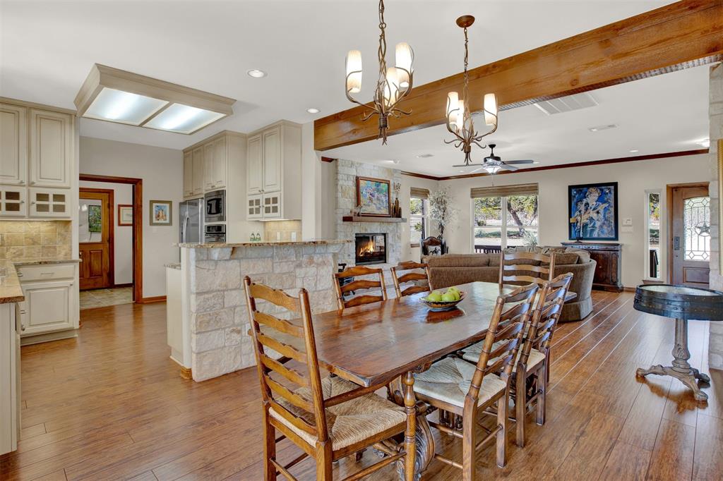 5255 Lookout Ridge Drive Marble Falls, TX 78654 - Photo 4 of 40 Dining with wood floors beside granite kitchen