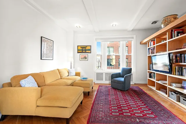 a living room with furniture and a rug