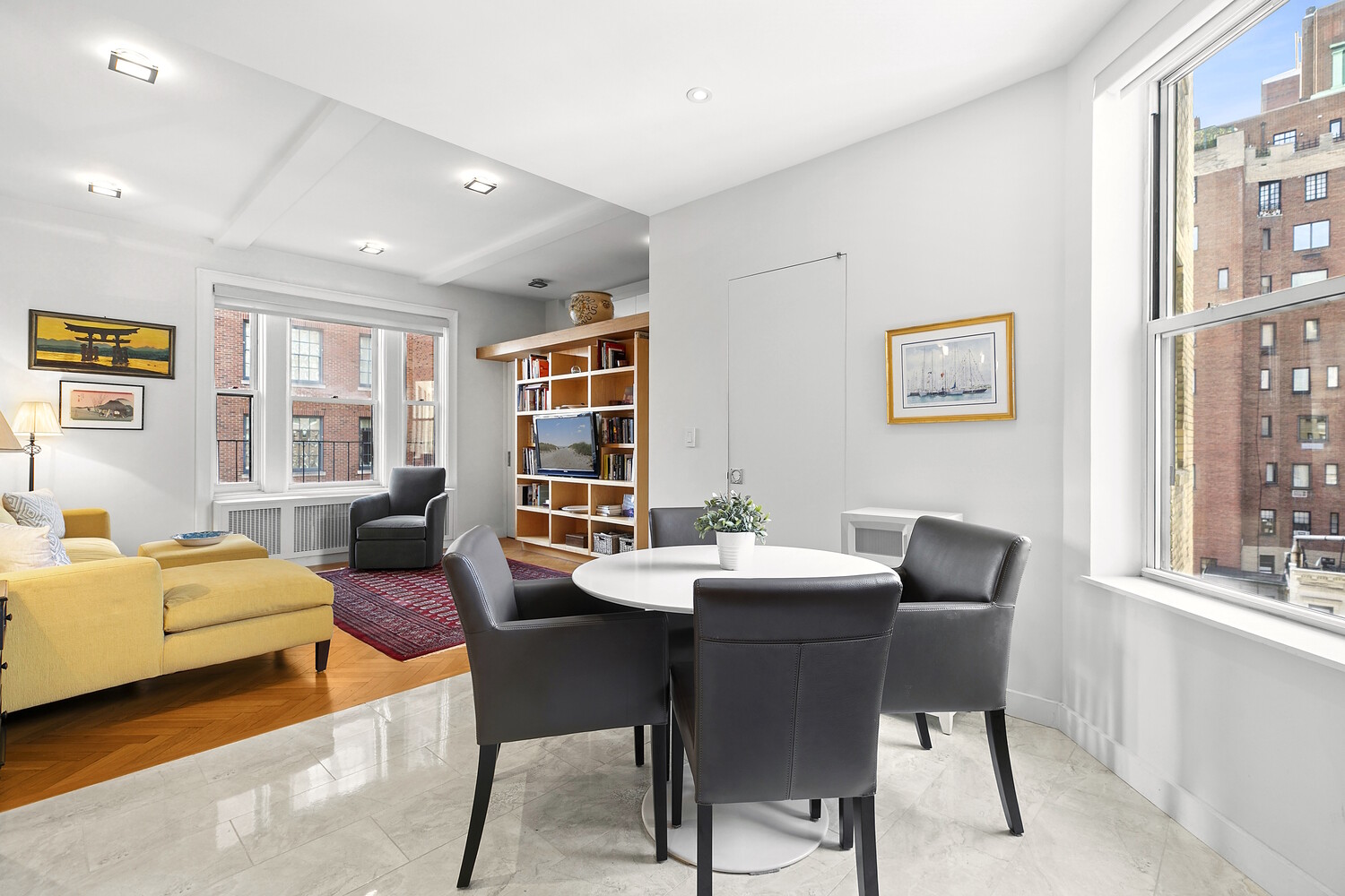 156 East 79th Street, Unit 9F Manhattan, NY 10075 - Photo 4 of 12 a view of a livingroom with furniture and windows