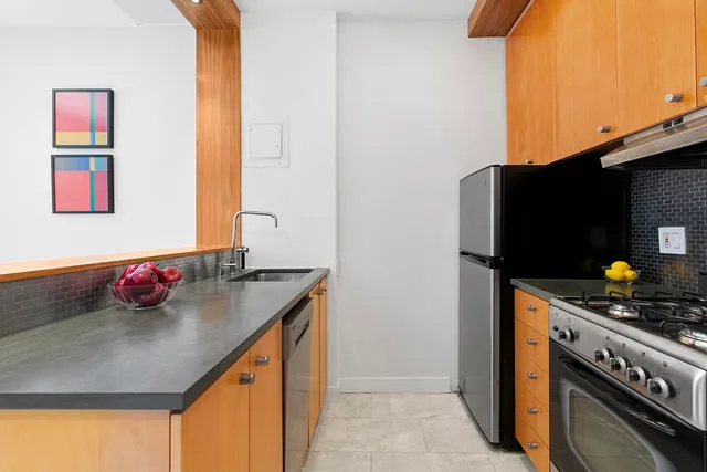 a kitchen with a sink and a stove