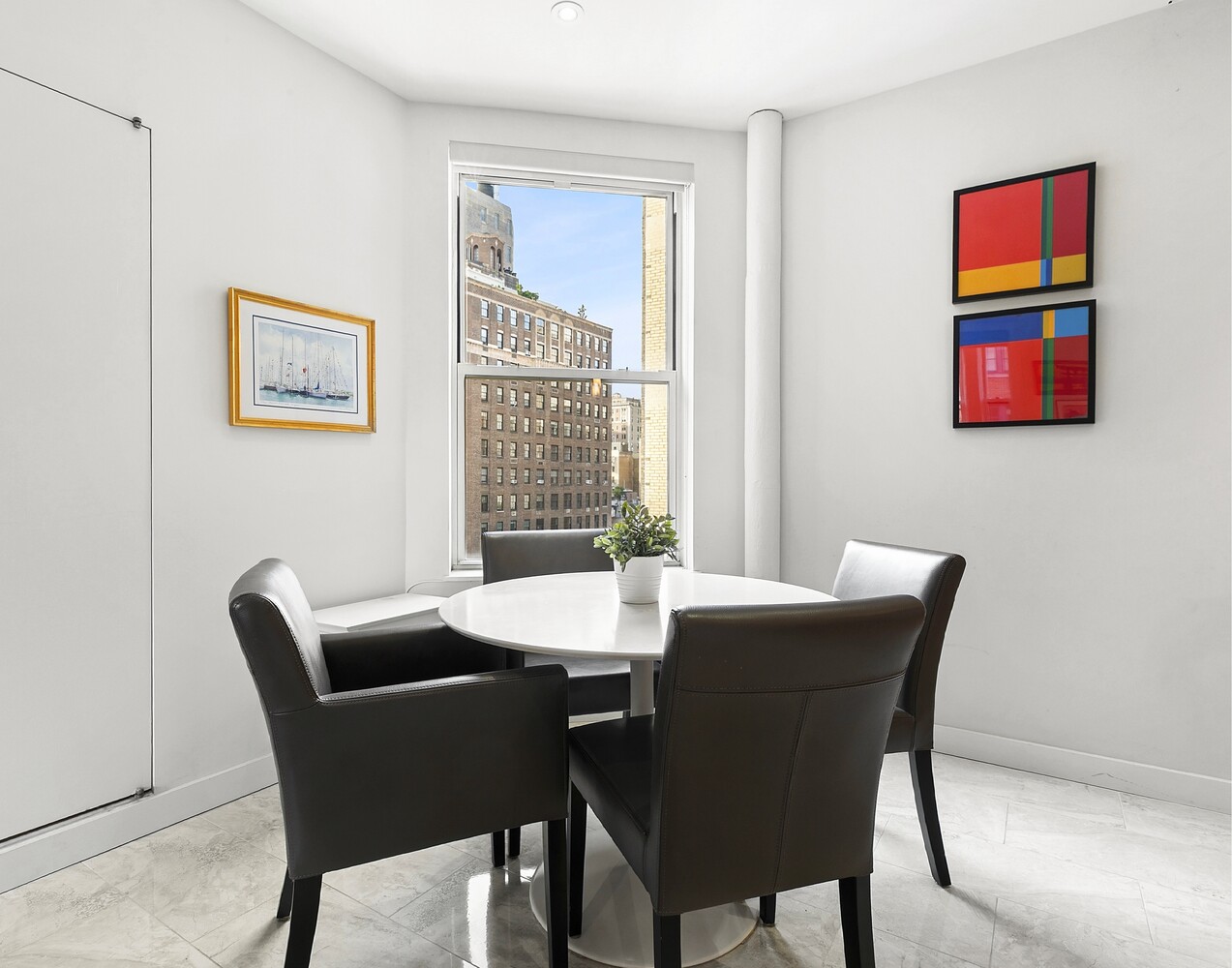 156 East 79th Street, Unit 9F Manhattan, NY 10075 - Photo 7 of 12 a view of a dining room with furniture window and wooden floor