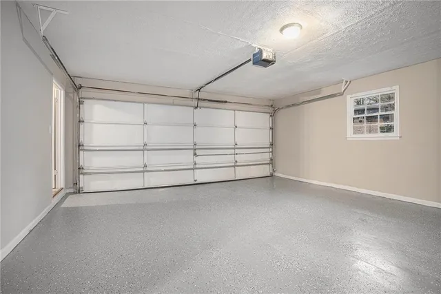 an empty room with a empty space and windows