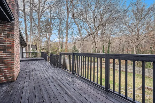 a view of a wooden deck with a trees