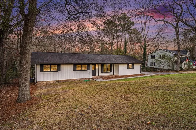 a front view of a house with yard