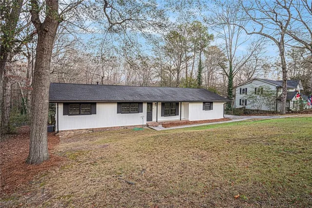 a house with trees in front of it