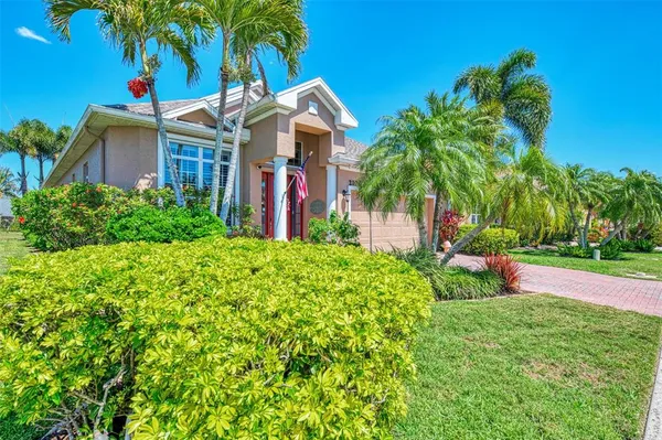 a front view of a house with yard and entertaining space