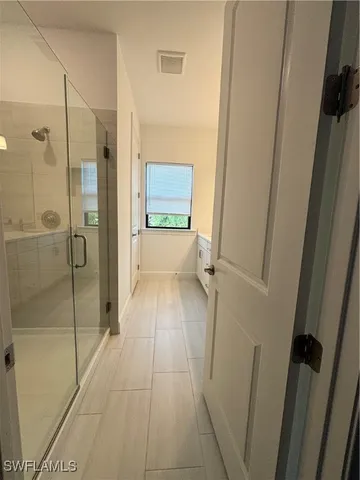 a bathroom with a shower and a toilet