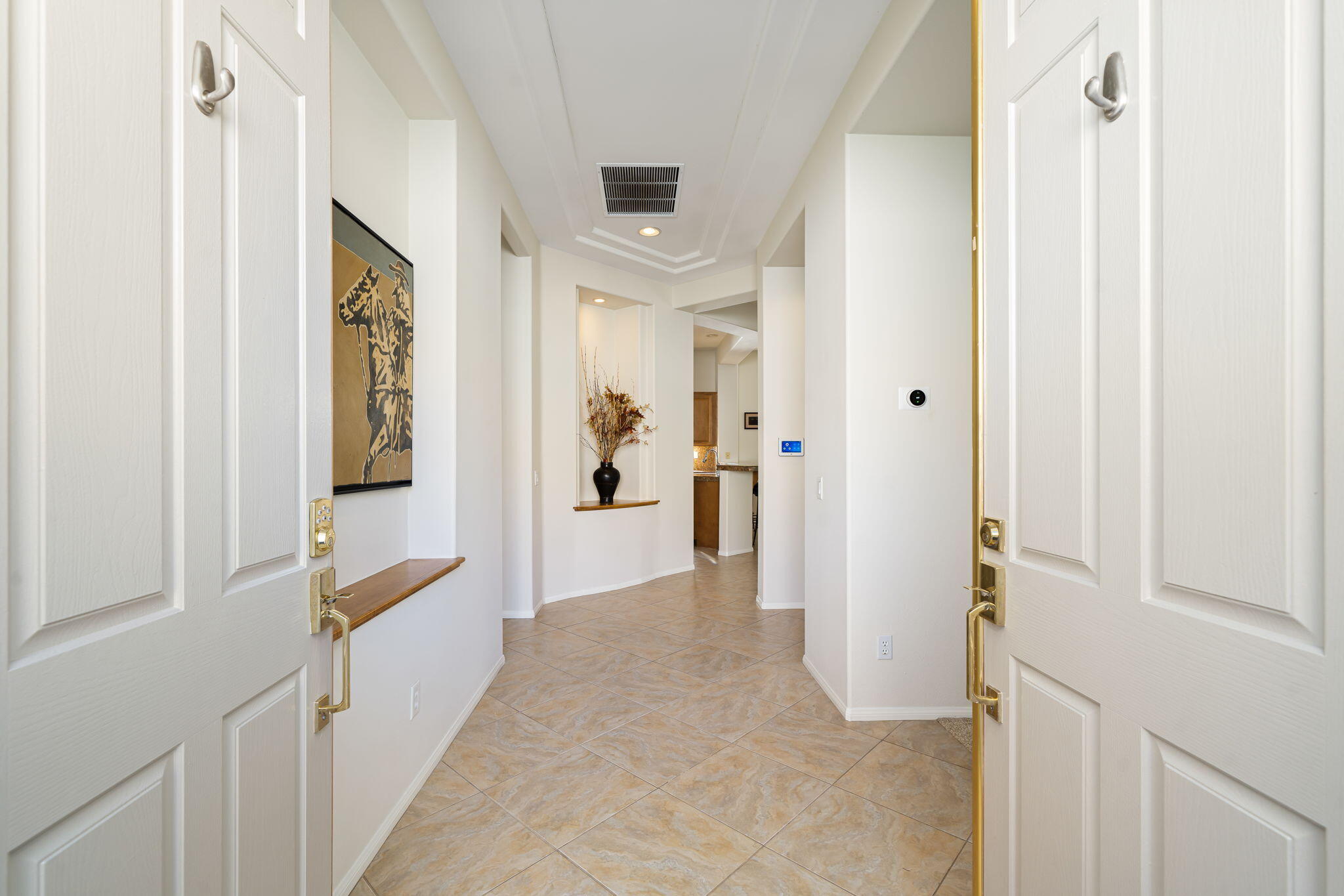54275 Riviera La Quinta, CA 92253 - Photo 11 of 50 a view of a hallway with wooden floor and staircase