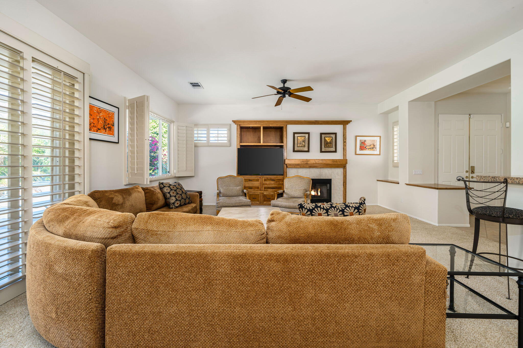 54275 Riviera La Quinta, CA 92253 - Photo 16 of 50 a living room with furniture and a fireplace
