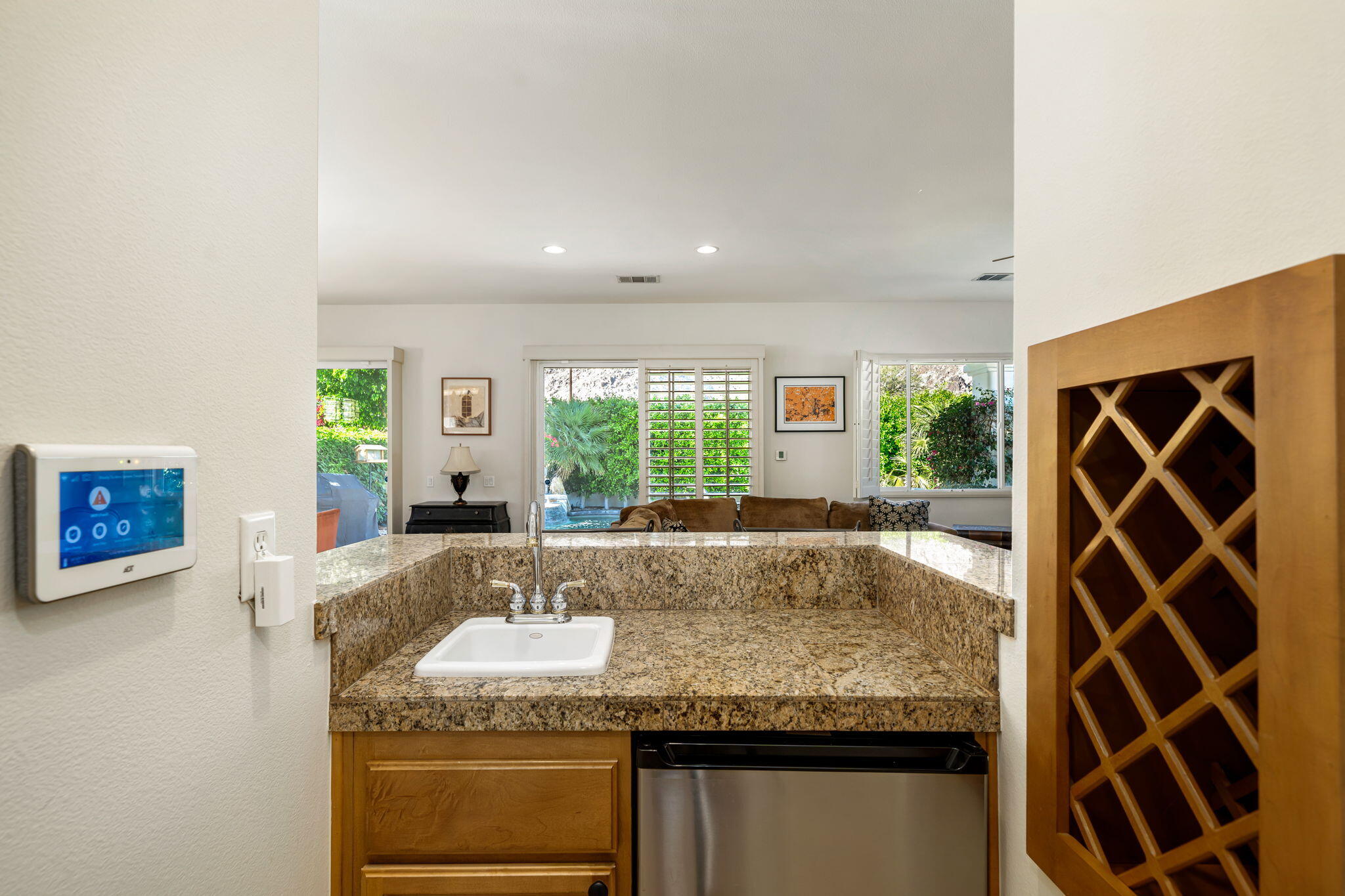 54275 Riviera La Quinta, CA 92253 - Photo 18 of 50 a living room with granite countertop furniture and a fireplace
