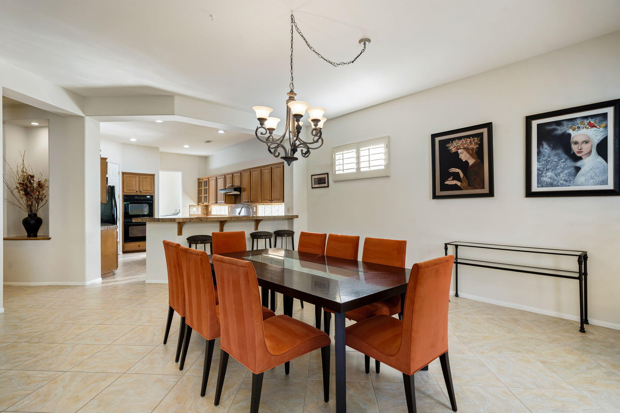 54275 Riviera La Quinta, CA 92253 - Photo 21 of 50 a view of a dining room with furniture and chandelier