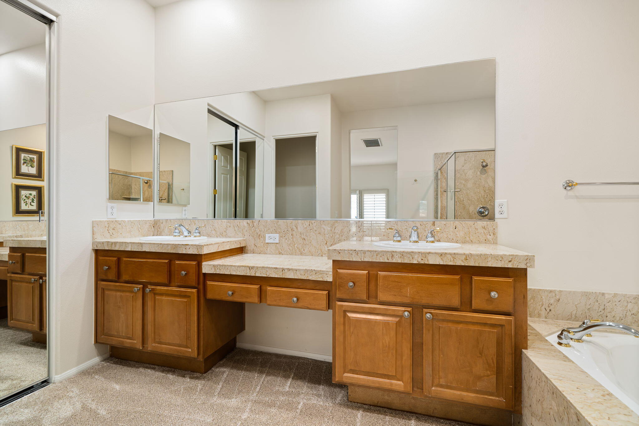 54275 Riviera La Quinta, CA 92253 - Photo 30 of 50 a spacious bathroom with a sink and a mirror