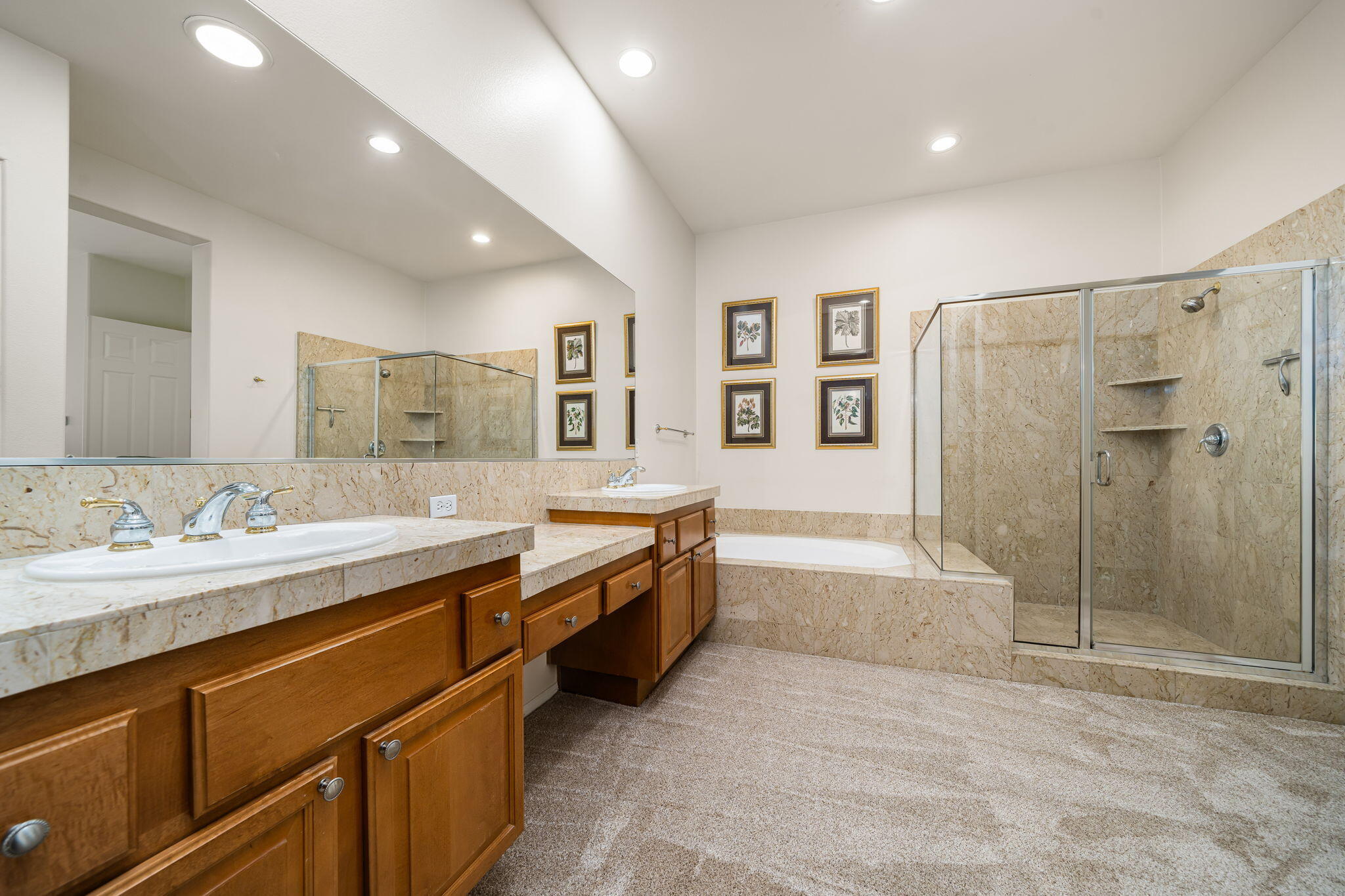 54275 Riviera La Quinta, CA 92253 - Photo 32 of 50 a large bathroom with a double vanity sink a large mirror and shower