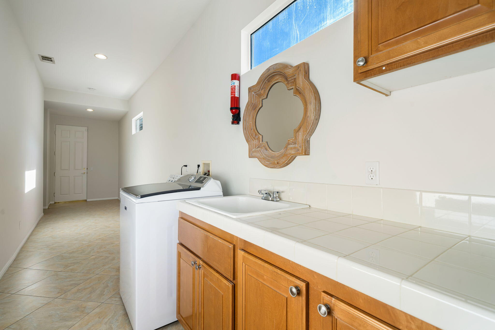 54275 Riviera La Quinta, CA 92253 - Photo 38 of 50 a bathroom with a sink and a mirror