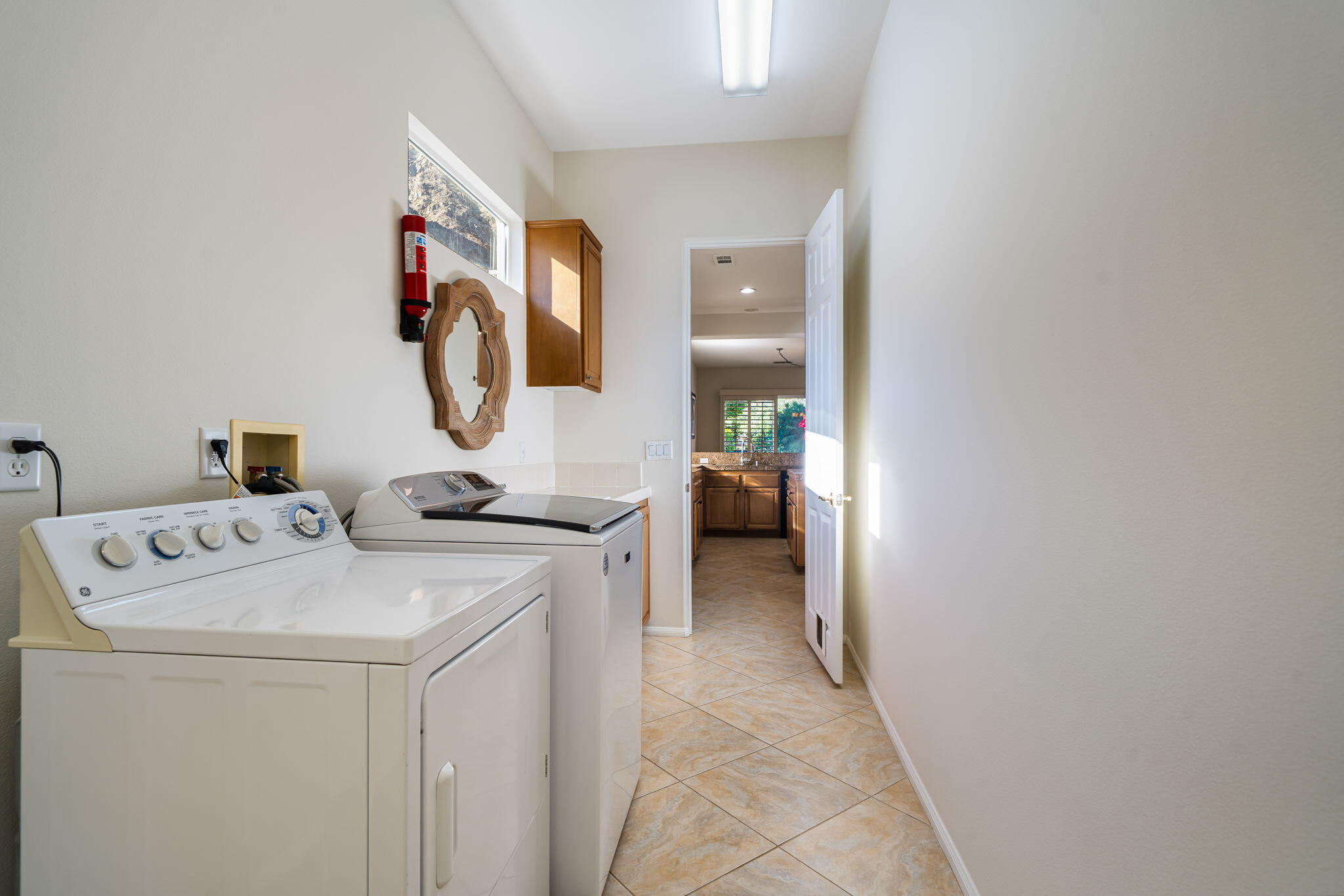 54275 Riviera La Quinta, CA 92253 - Photo 39 of 50 a utility room with dryer and washer