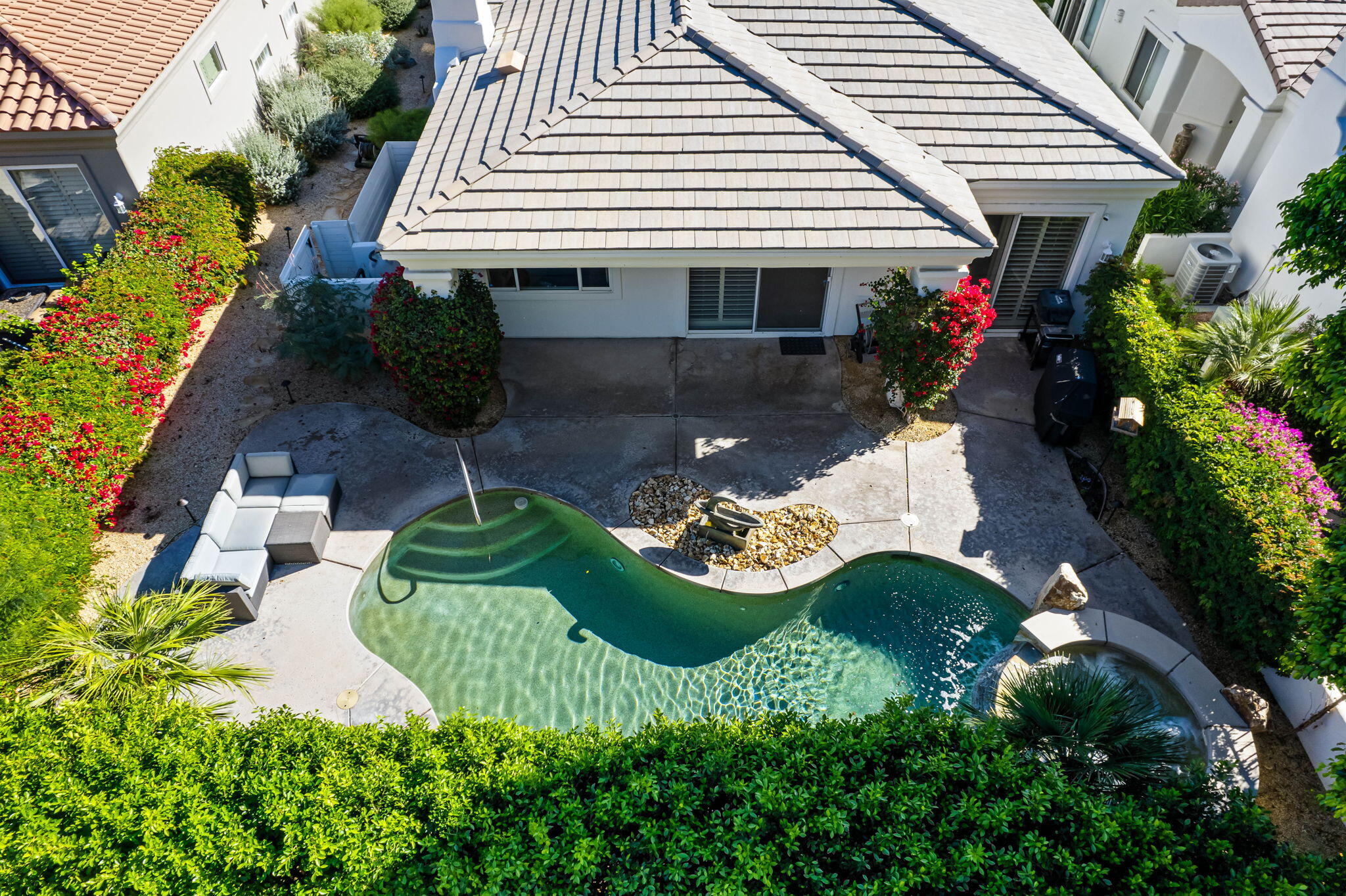 54275 Riviera La Quinta, CA 92253 - Photo 4 of 50 a view of a house with backyard and sitting area