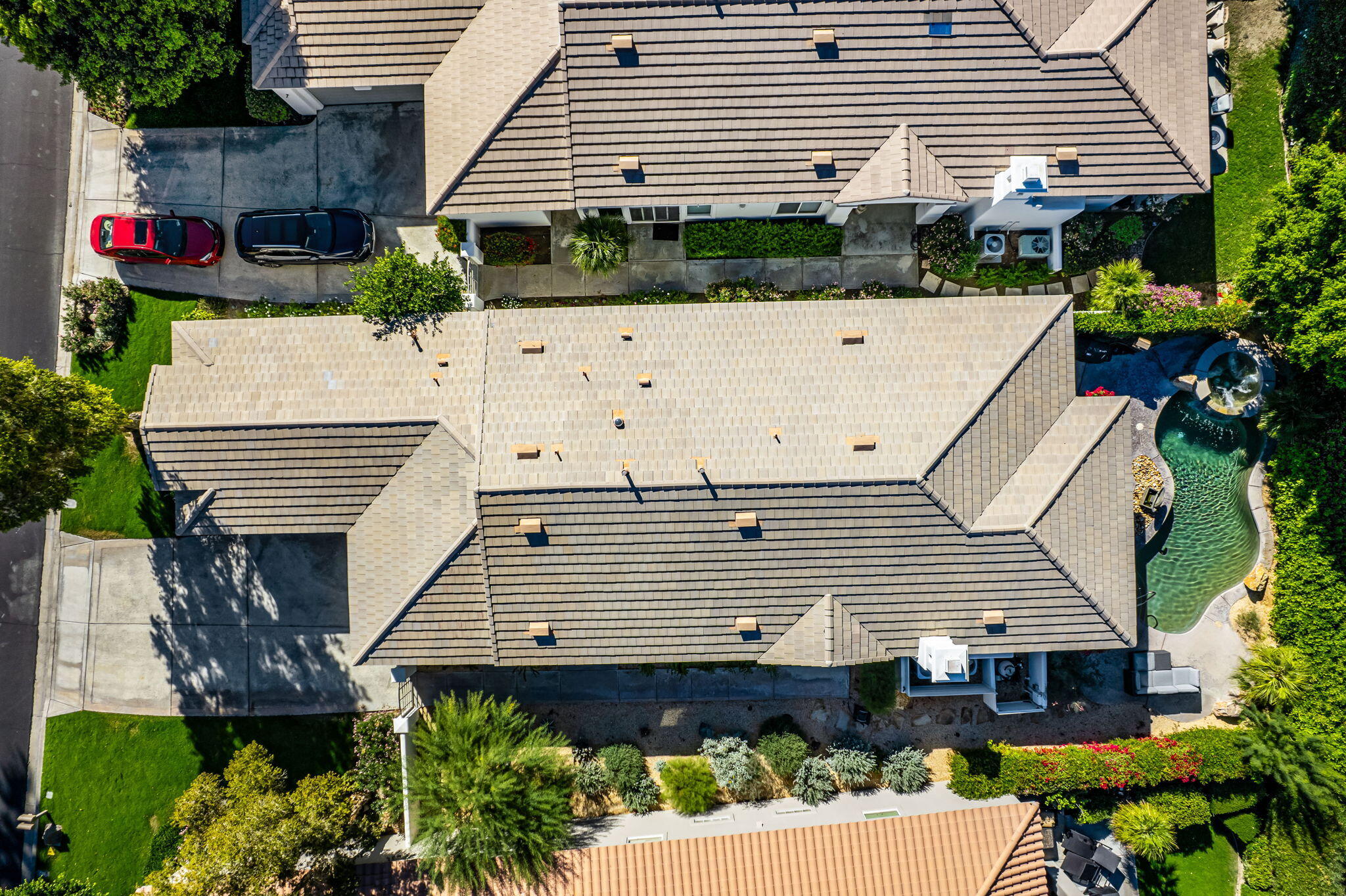 54275 Riviera La Quinta, CA 92253 - Photo 43 of 50 a view of a white house with a yard