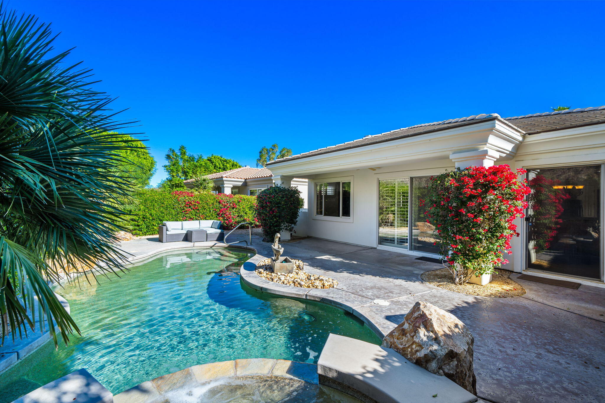 54275 Riviera La Quinta, CA 92253 - Photo 47 of 50 a view of a backyard with plants and a patio