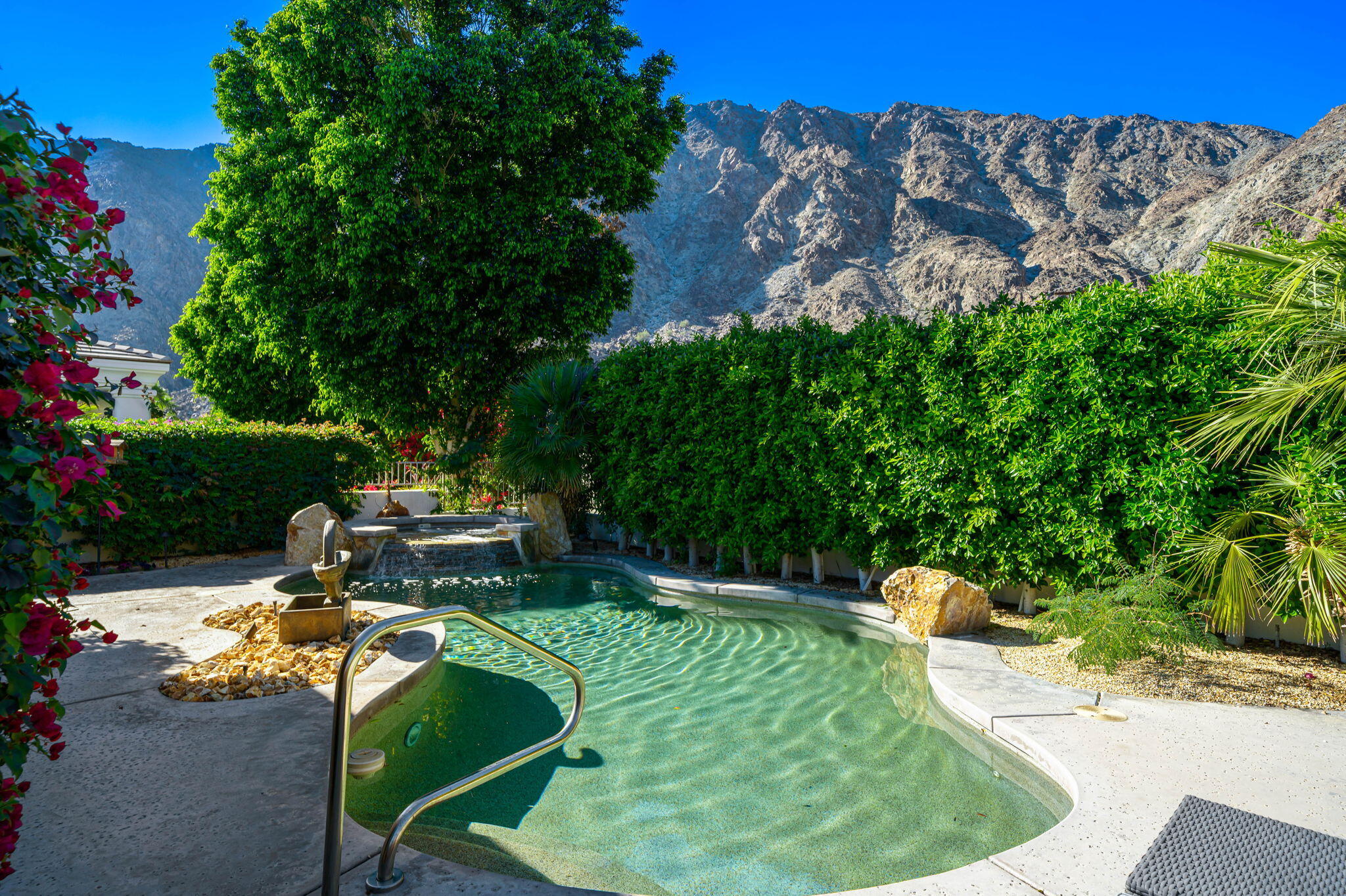 54275 Riviera La Quinta, CA 92253 - Photo 5 of 50 a backyard of a house with yard and outdoor seating