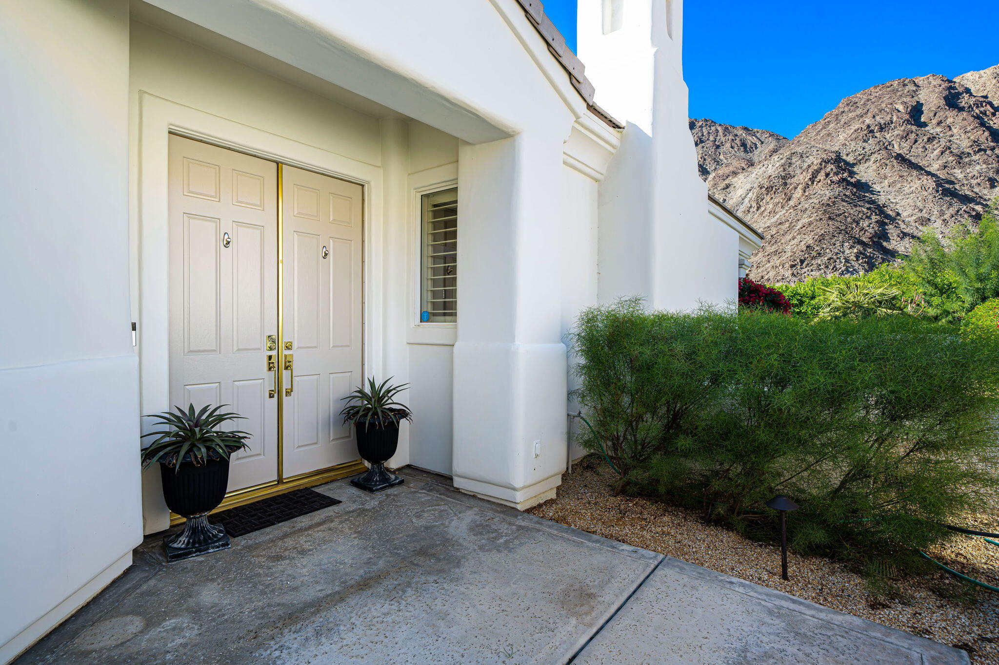 54275 Riviera La Quinta, CA 92253 - Photo 10 of 50 a view of a house with backyard