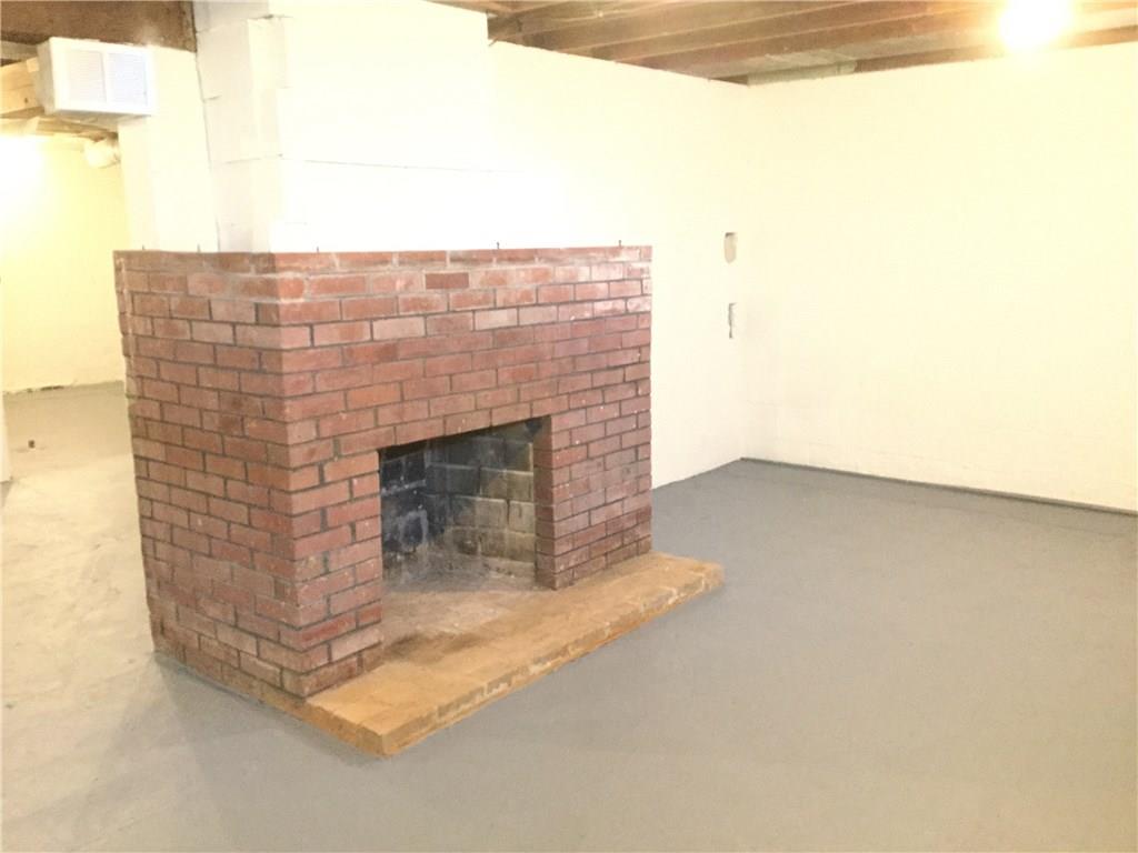 3779 Hubbard-Middlesex Road West Middlesex, PA 16159 - Photo 16 of 22 WOOD BURNING FIREPLACE IN BASEMENT HASN'T BEEN USED IN A LONG TIME.